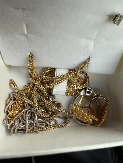 Chains, rings and other jewellery in a lined box